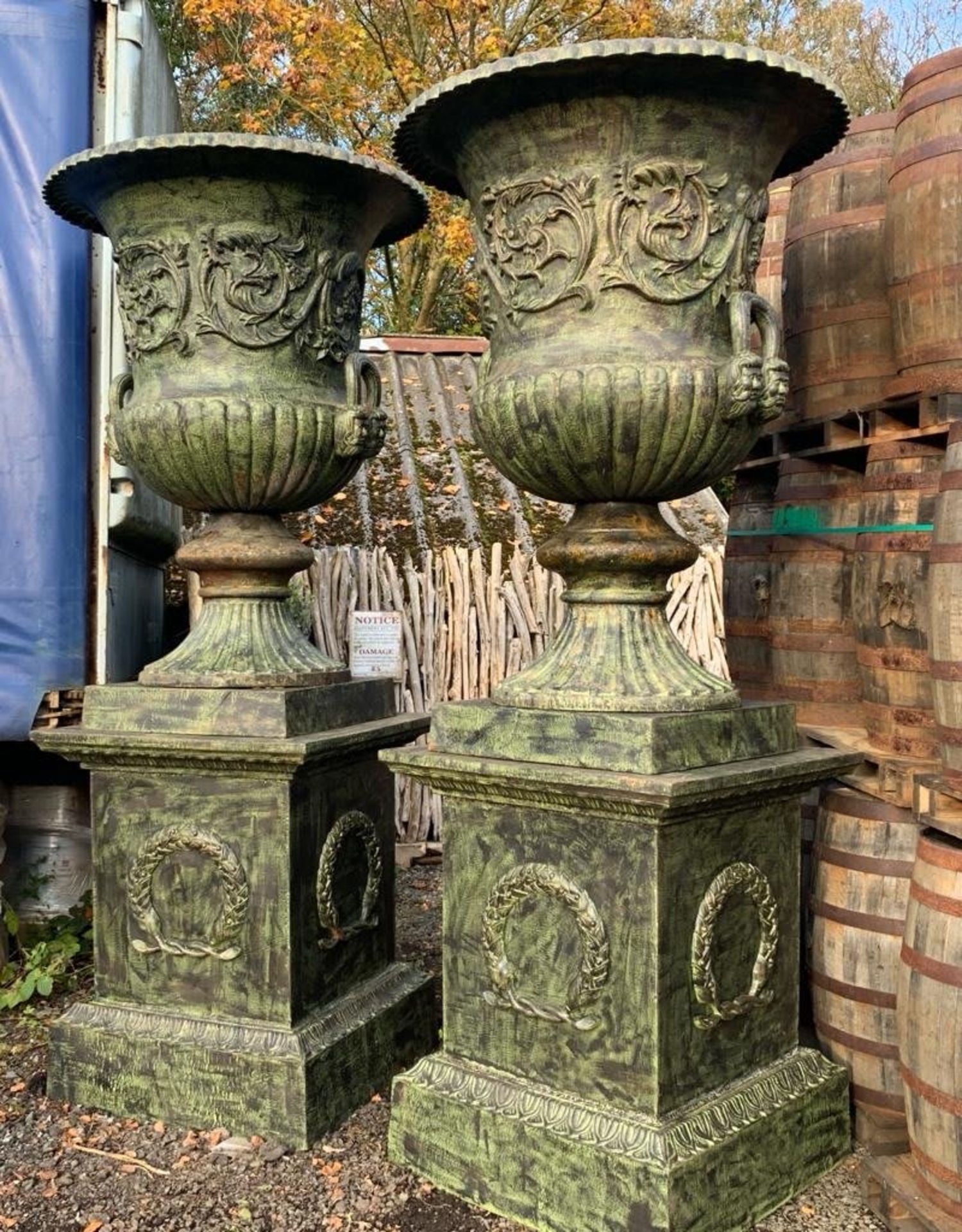 2.8M HIGH HUGE PAIR EXCEPTIONAL CAST IRON MONUMENTAL CAMPANA STYLE URNS ON PLINTH, IN THE MANNER OF