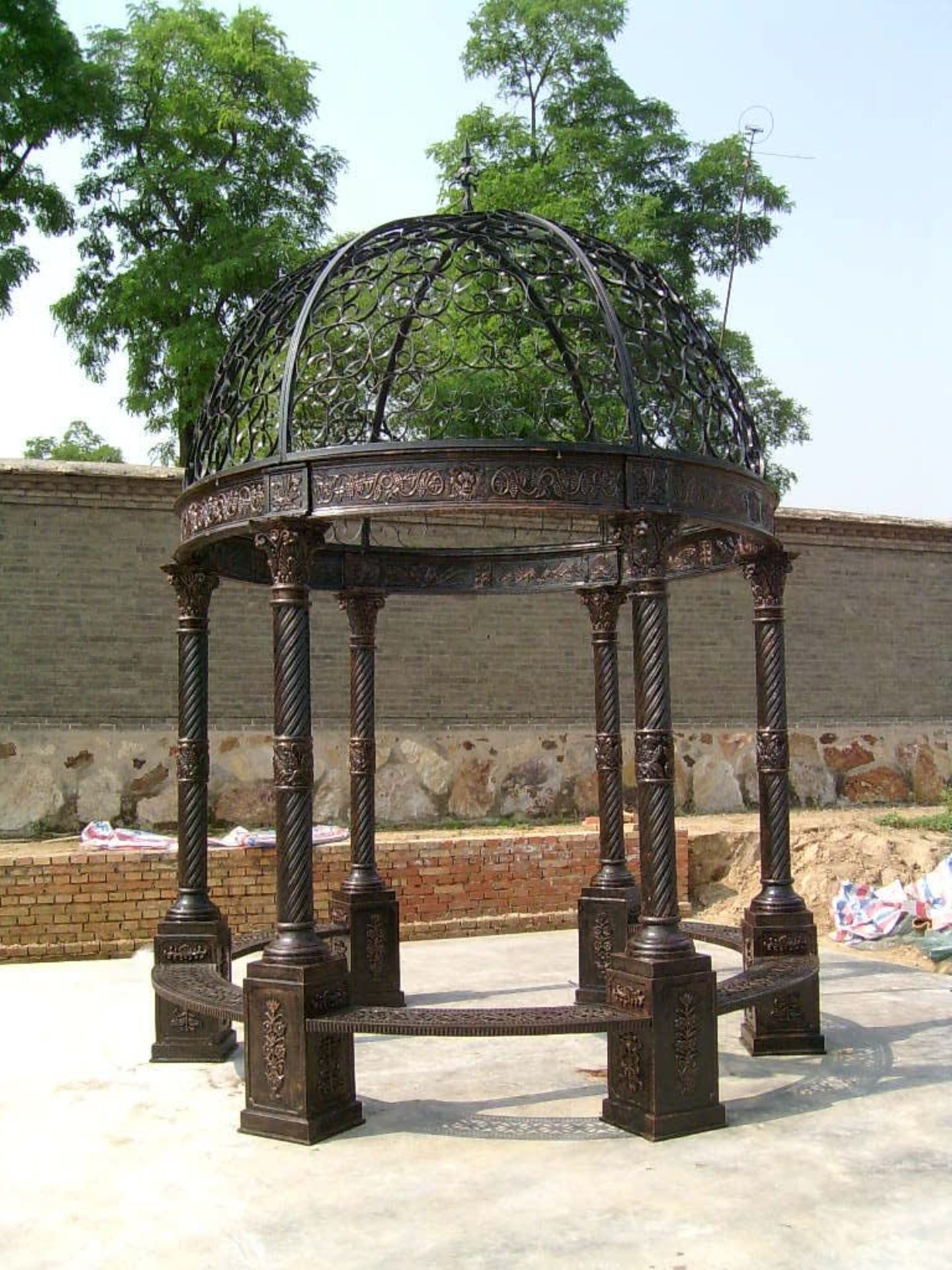 CAST IRON ORNATE GAZEBO WITH CORINTHIUM COLUMNS AND ORNATE WROUGHT IRON ROOF