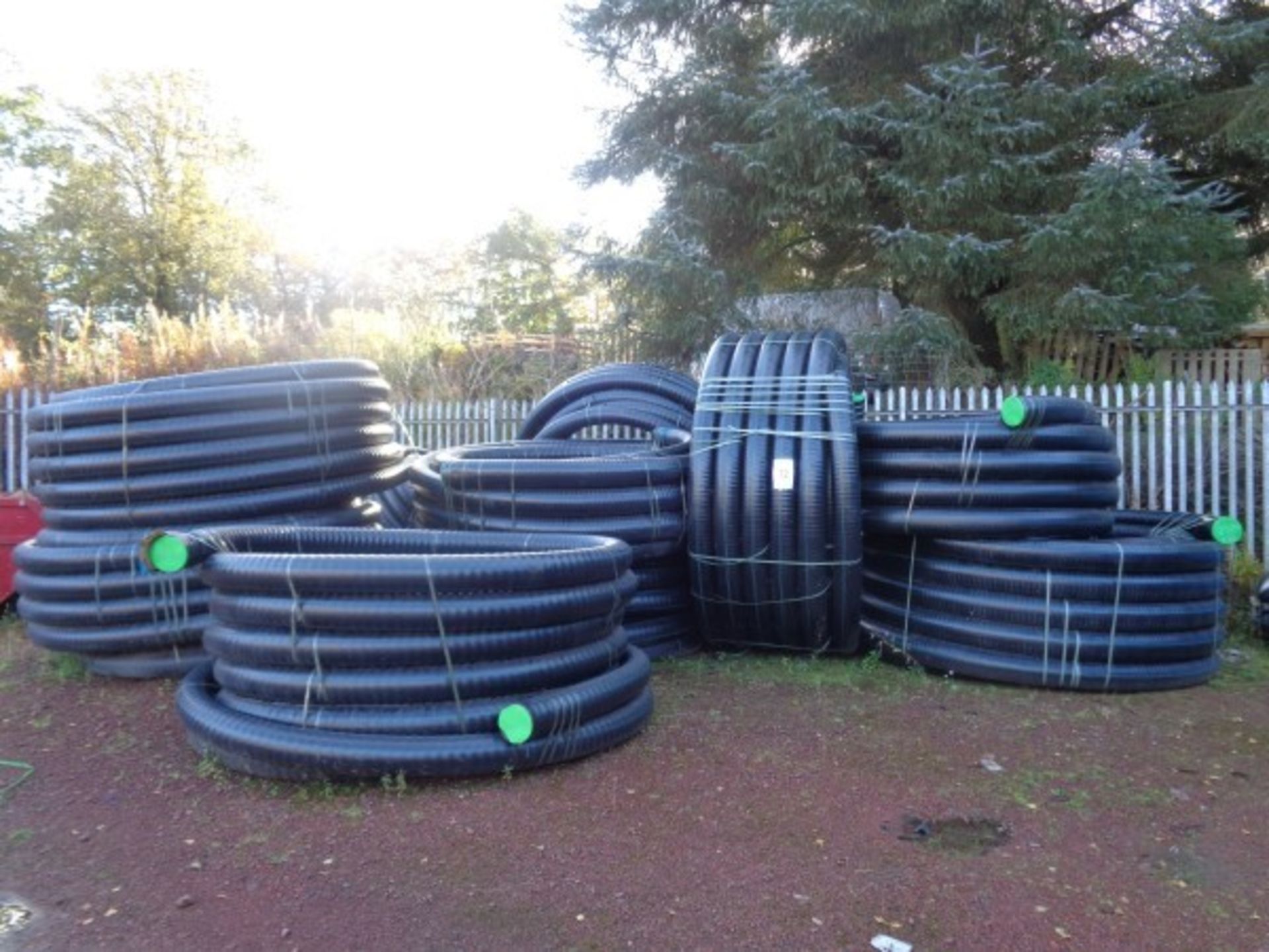 15 X Rolls of black plastic insulated 4" pipe