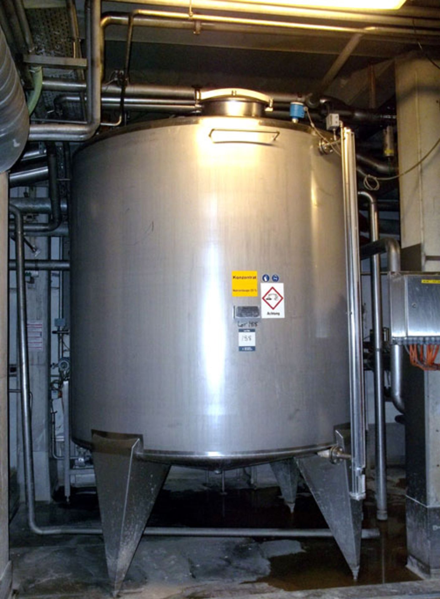 Binder GMBH Tank, 9200 Liter (2430 Gallon), Stainless Steel, Vertical Coned bottom. Mounted on legs.