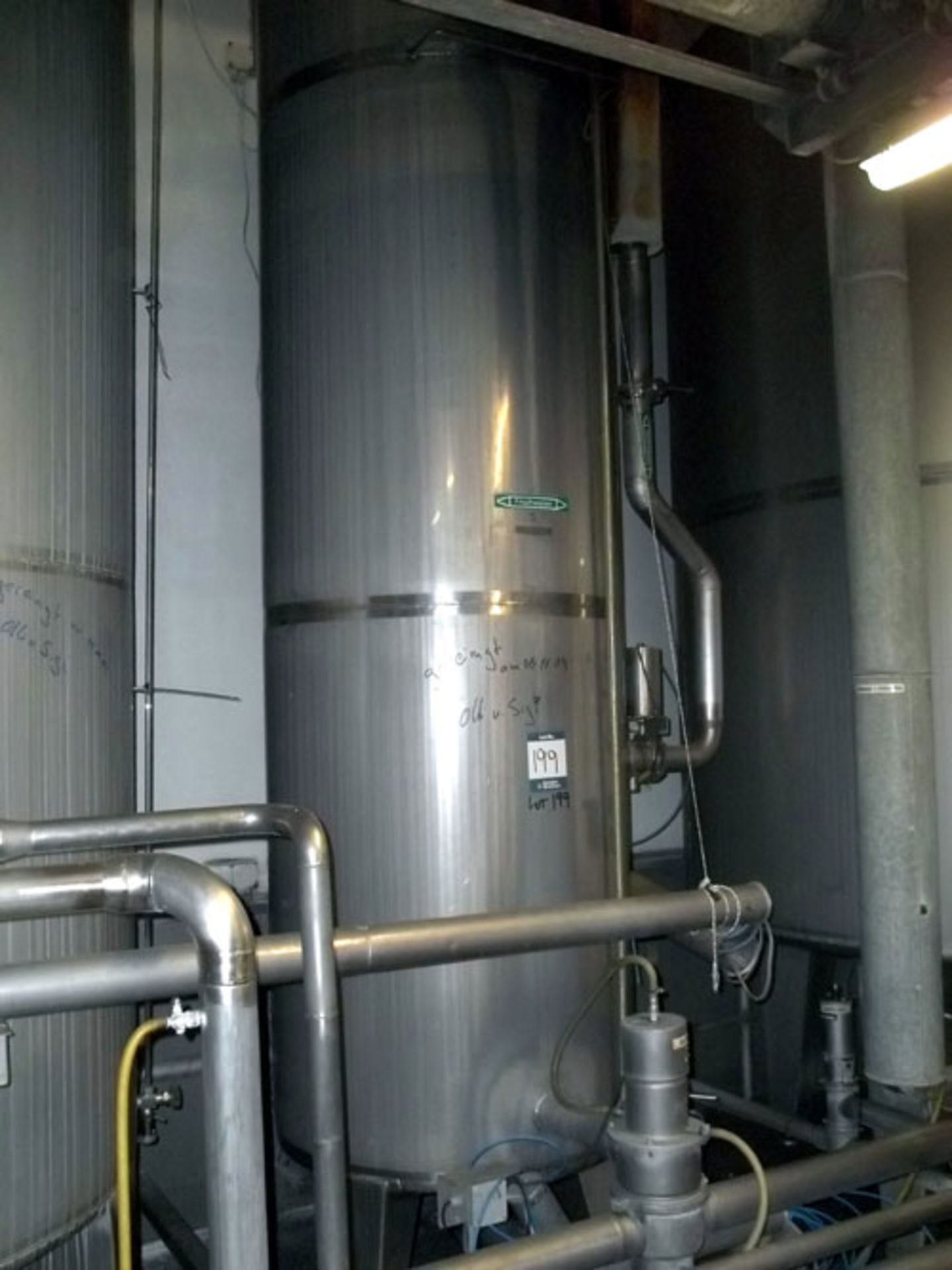 Tank, Approximate 2000 Liter (528 Gallon), Stainless Steel, Vertical. Coned bottom. Mounted on 3