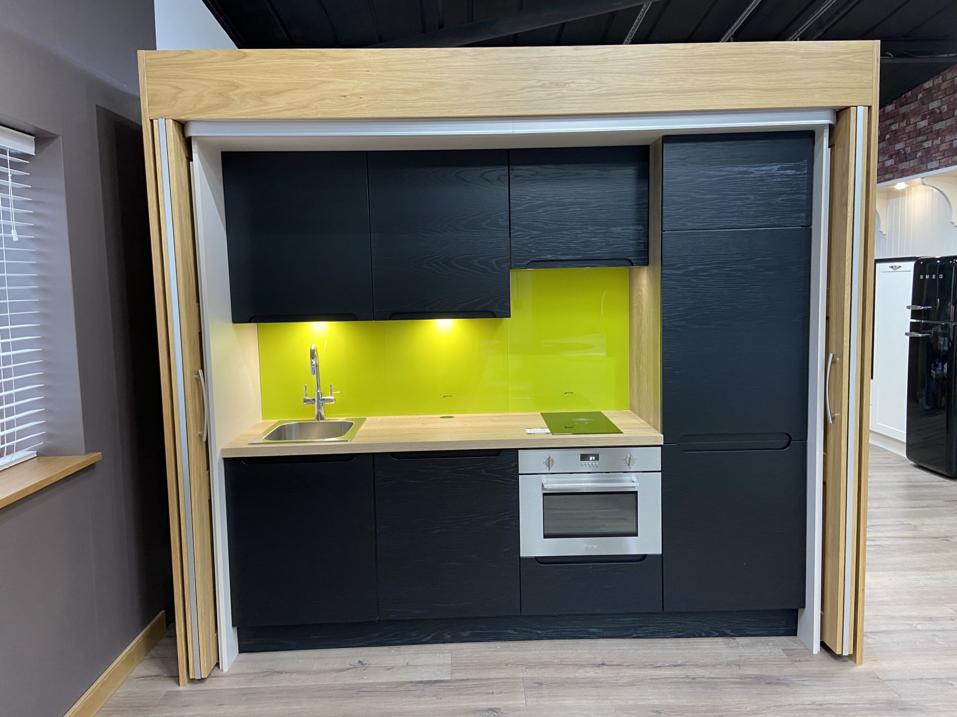 "Hideaway" contemporary ex-display kitchen finished in Apollo black blue doors and Brunswick light