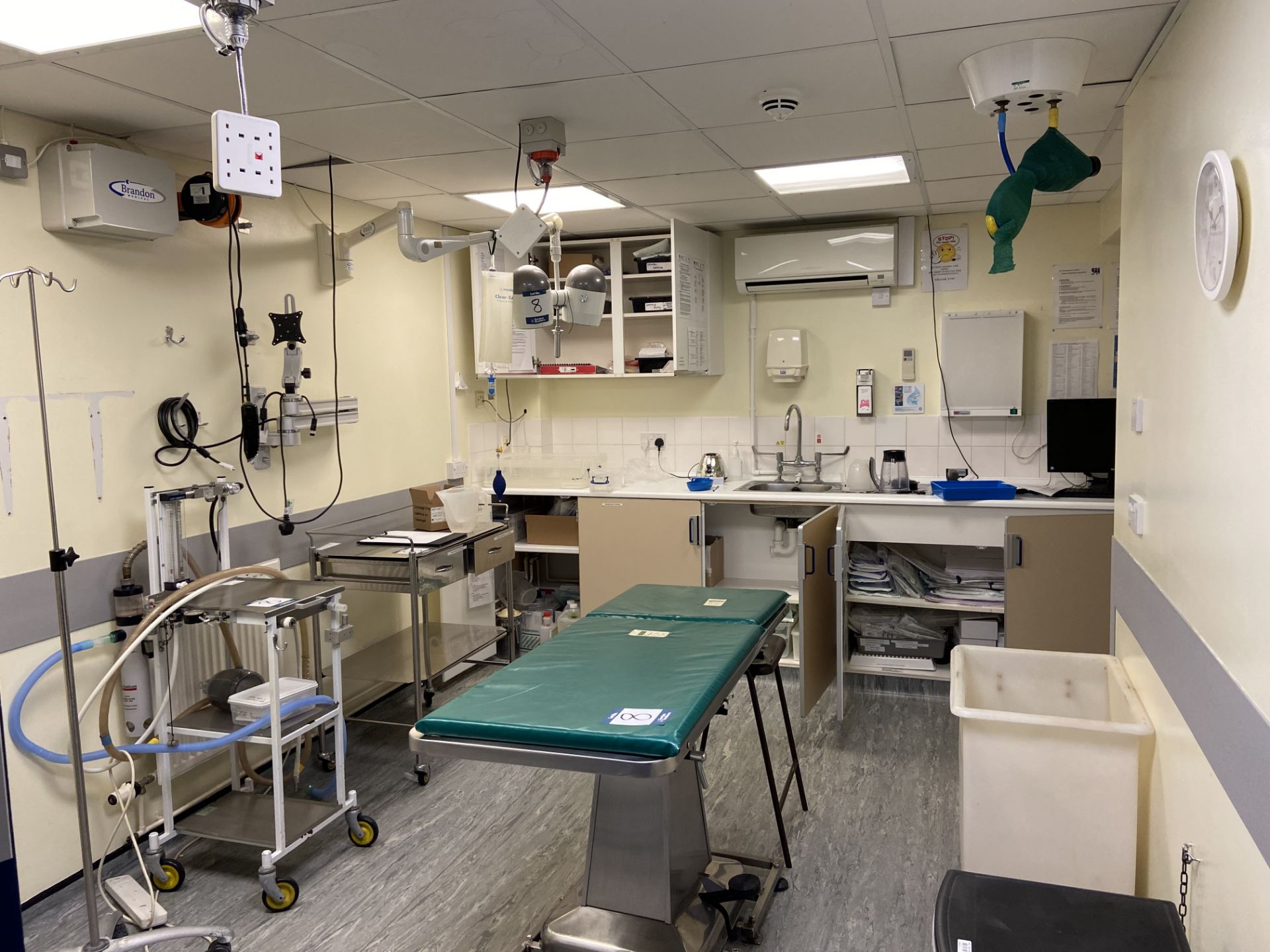 Contents of Minor Procedures Room including Shor-Line Kcmo stainless steel operating table with