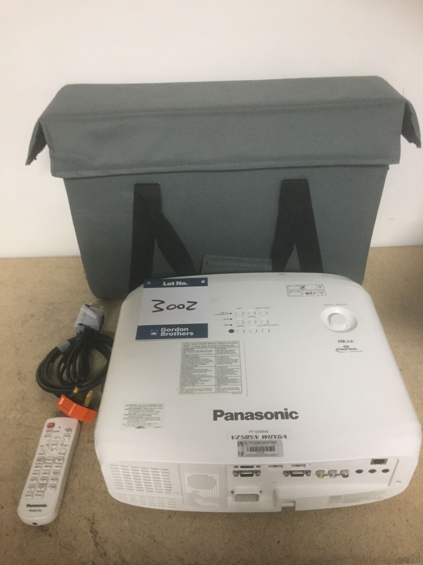 Panasonic PT-VZ585N WUXGA projector, including leads, remote and carry bag