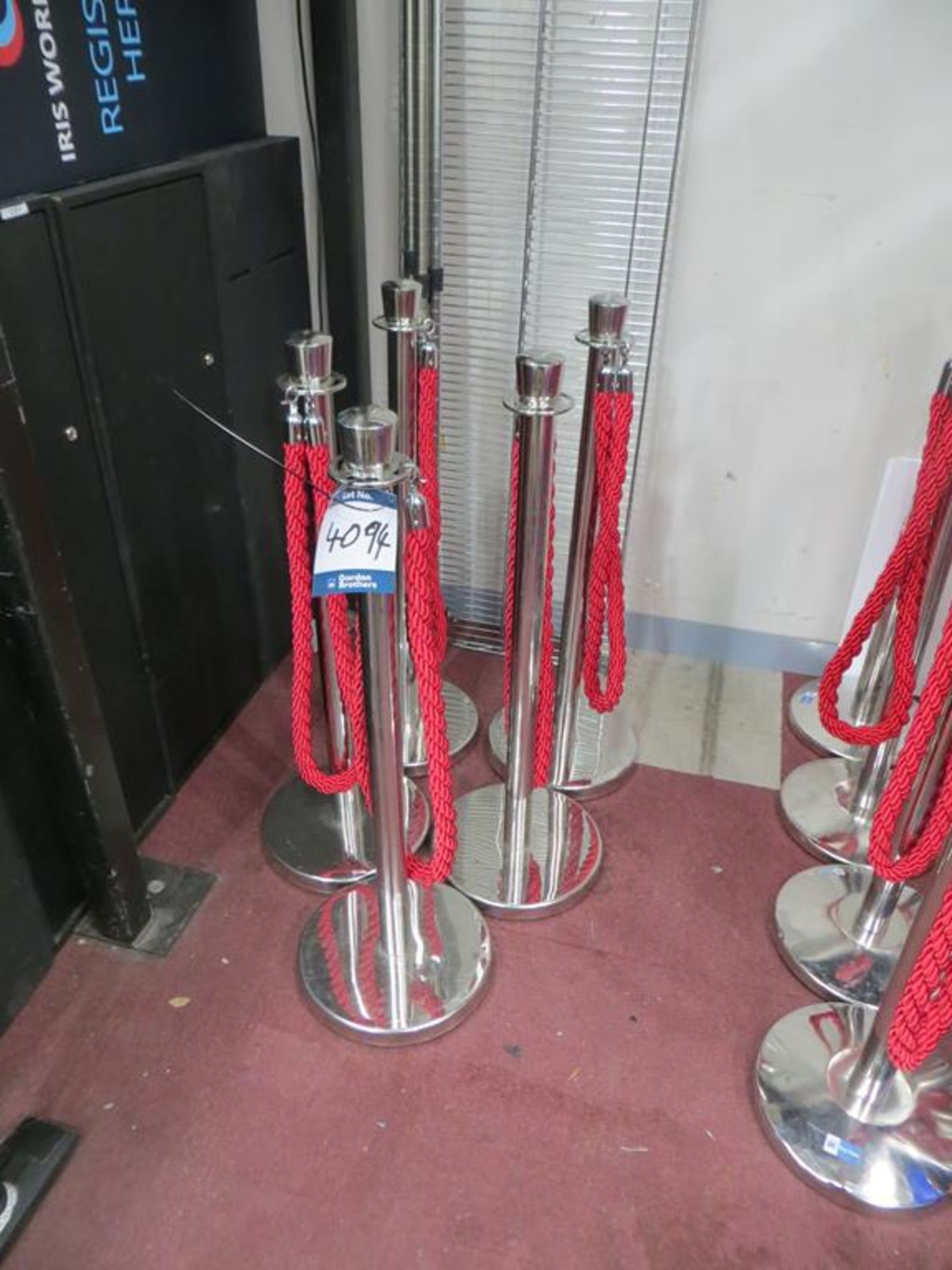 Rope barrier system comprising 21x No. chrome stands with red ropes and 21x No. spare ropes in