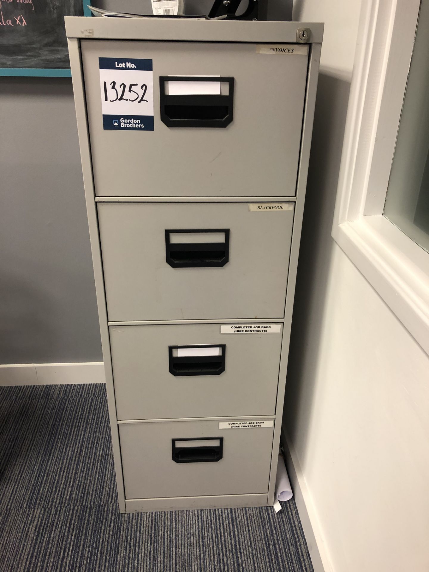 Metal four drawer filing cabinet