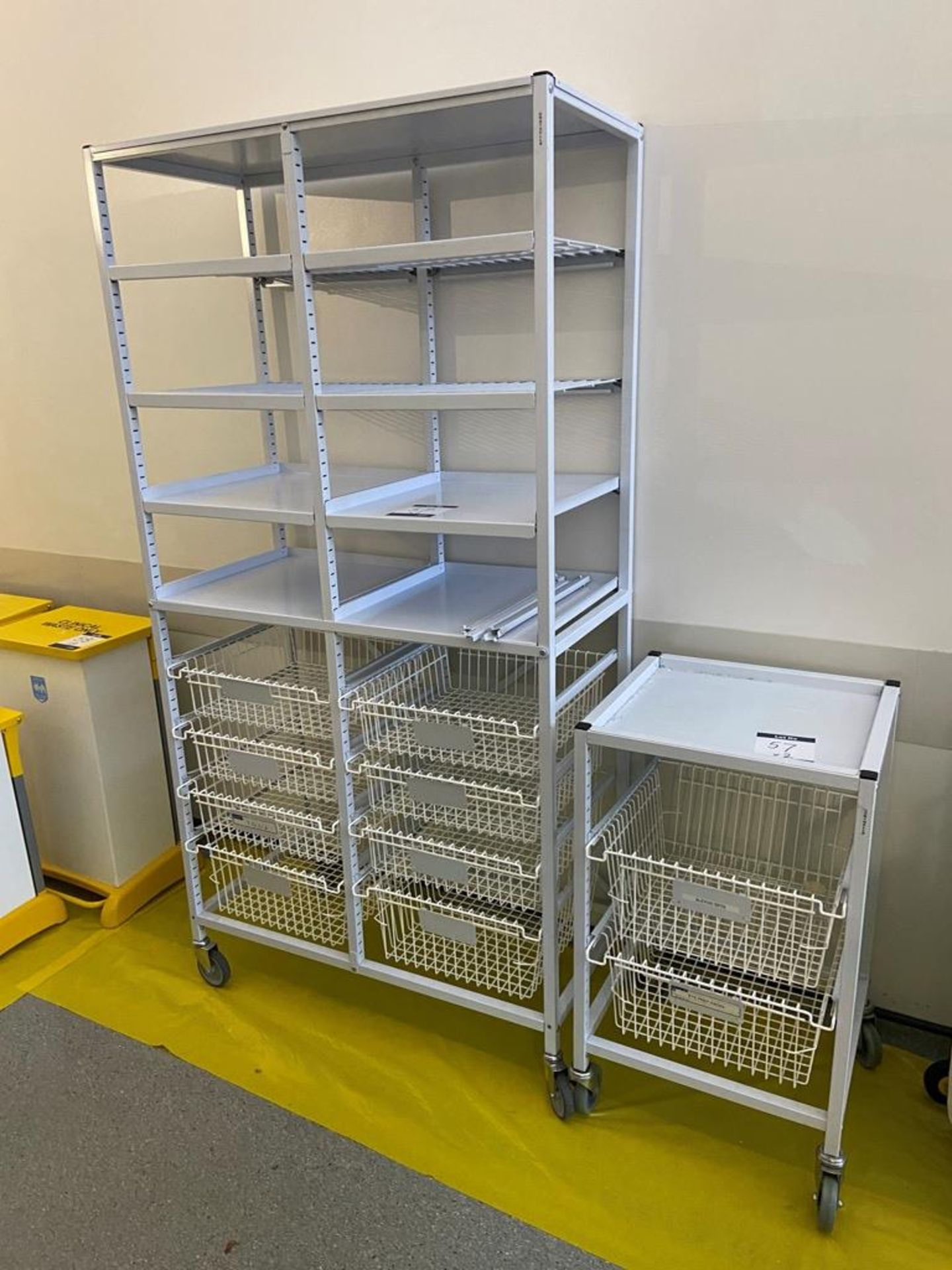 Two wheeled storage trollies; 1x No. single and 1x No. double with eight wire mesh drawers and eight