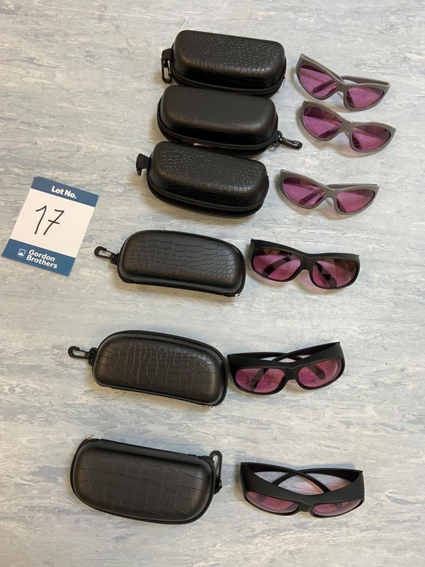 Six pairs of protective eyewear with cases