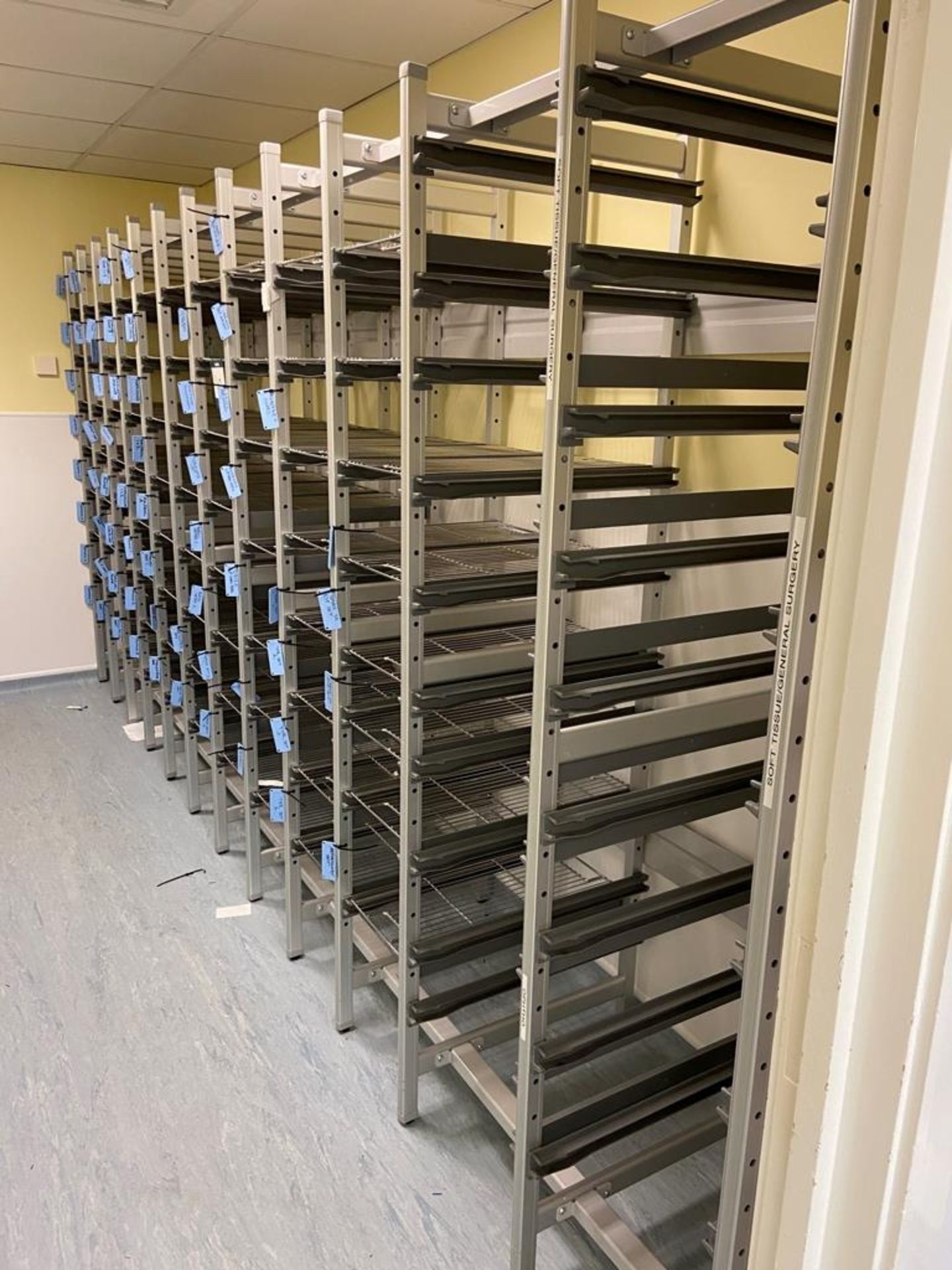 Ten bays of Surgical Instrument, multi-tier storage racking comprising: 8x No. bays with wire mesh