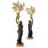 A pair of large figural vestibule candelabras