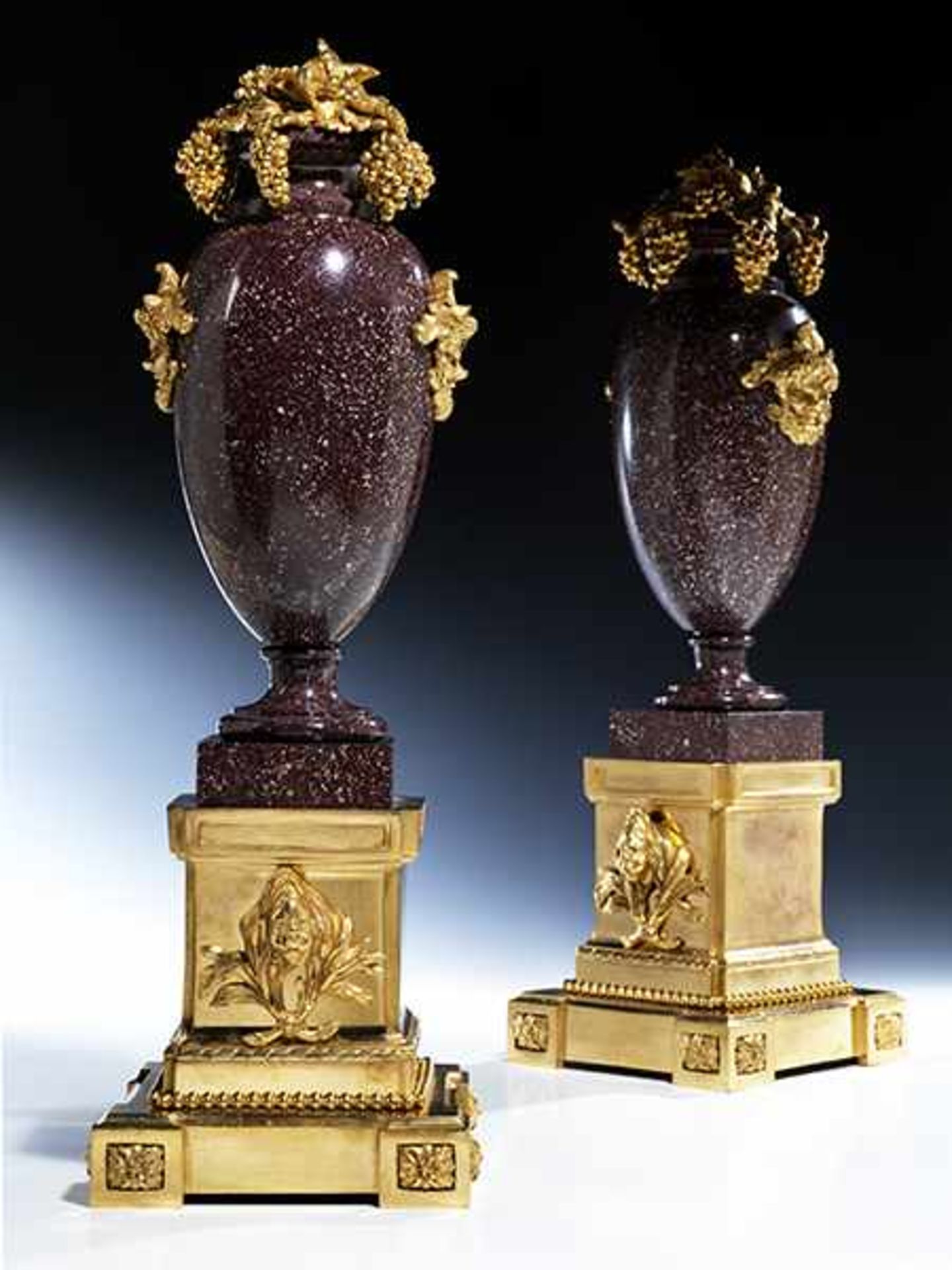 A pair of elegant decorative mantle vases in red, Egyptian porphyry and fire-gilt bronze
