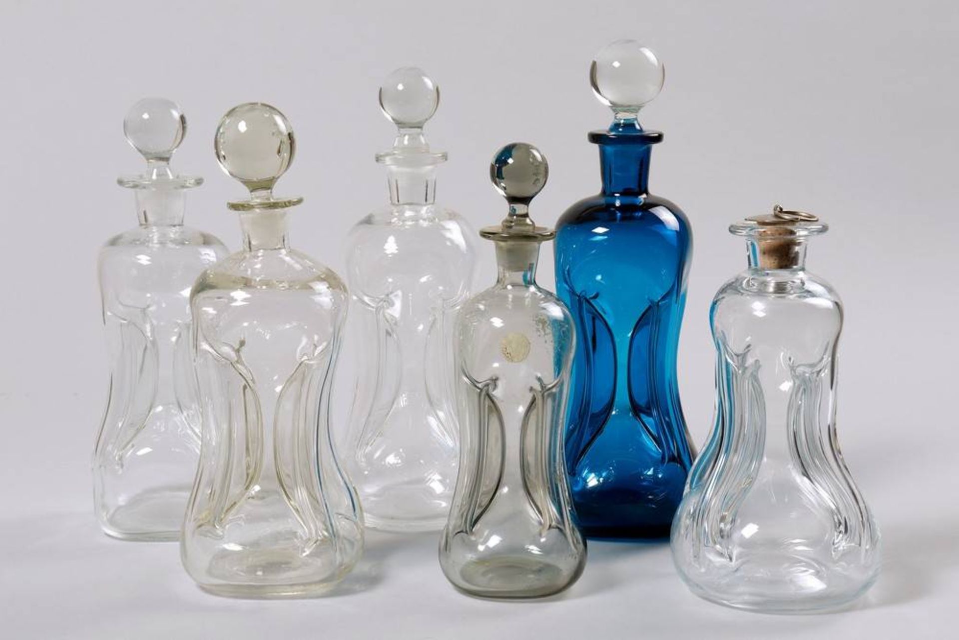 Collection of Decanters 6 pieces, Scandinavia, 20th C., clear and blue glass, H: 21-29cm, 1