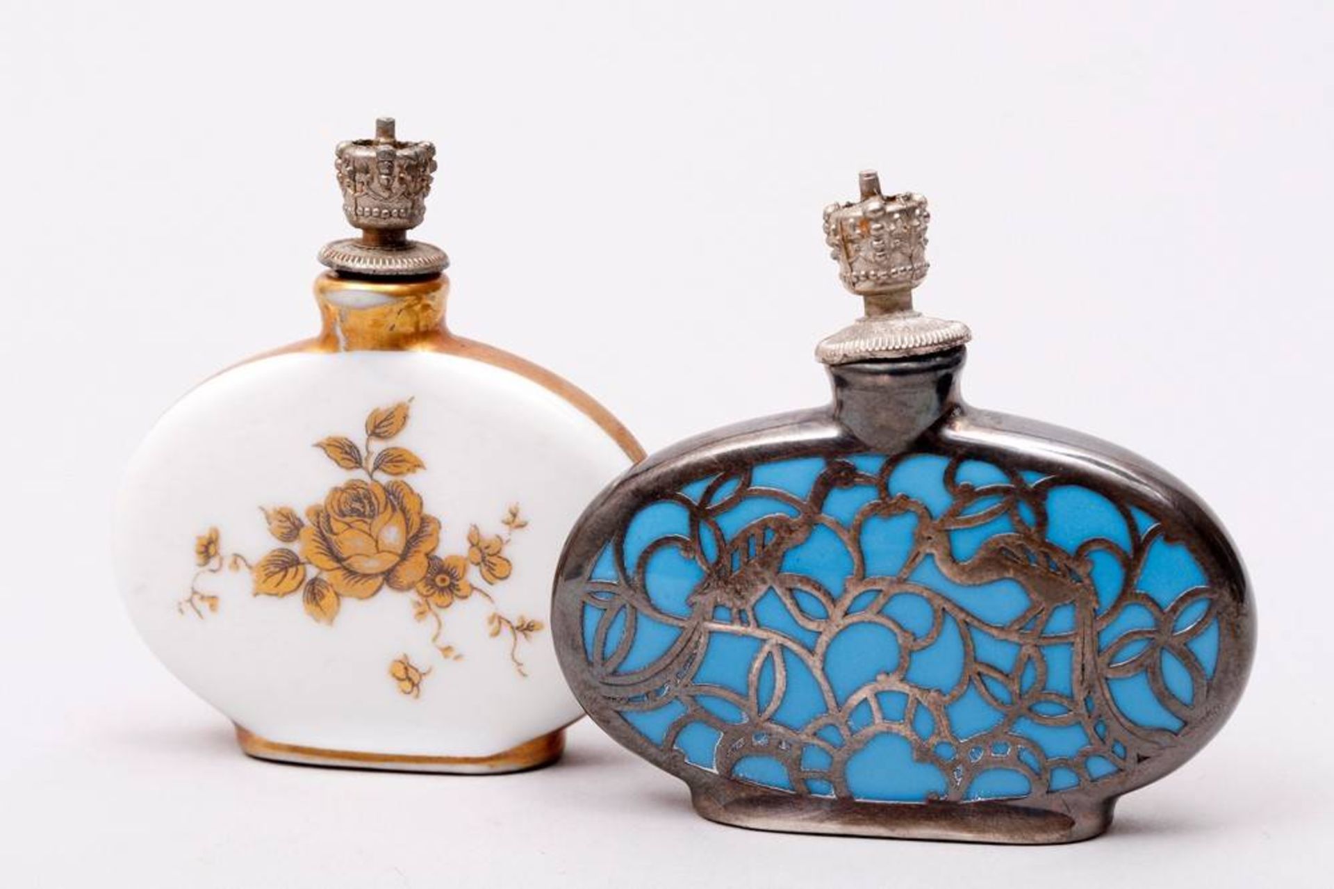 2 small Art-Deco perfume bottles german, ca. 1920, silver overlay and gilt decoration, porcelain, 1x