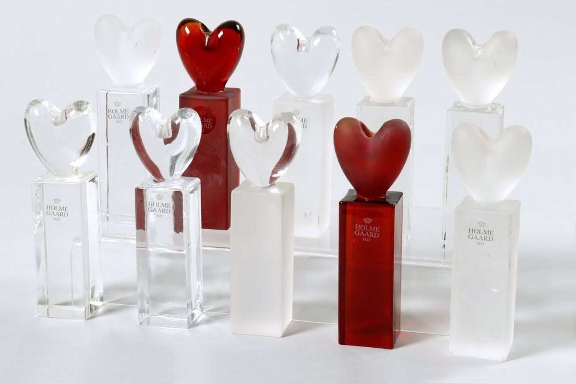 10 Candle Holders Holmegaard, 20th C., heart shaped, clear and red frosted glass, H: 13cm, signs