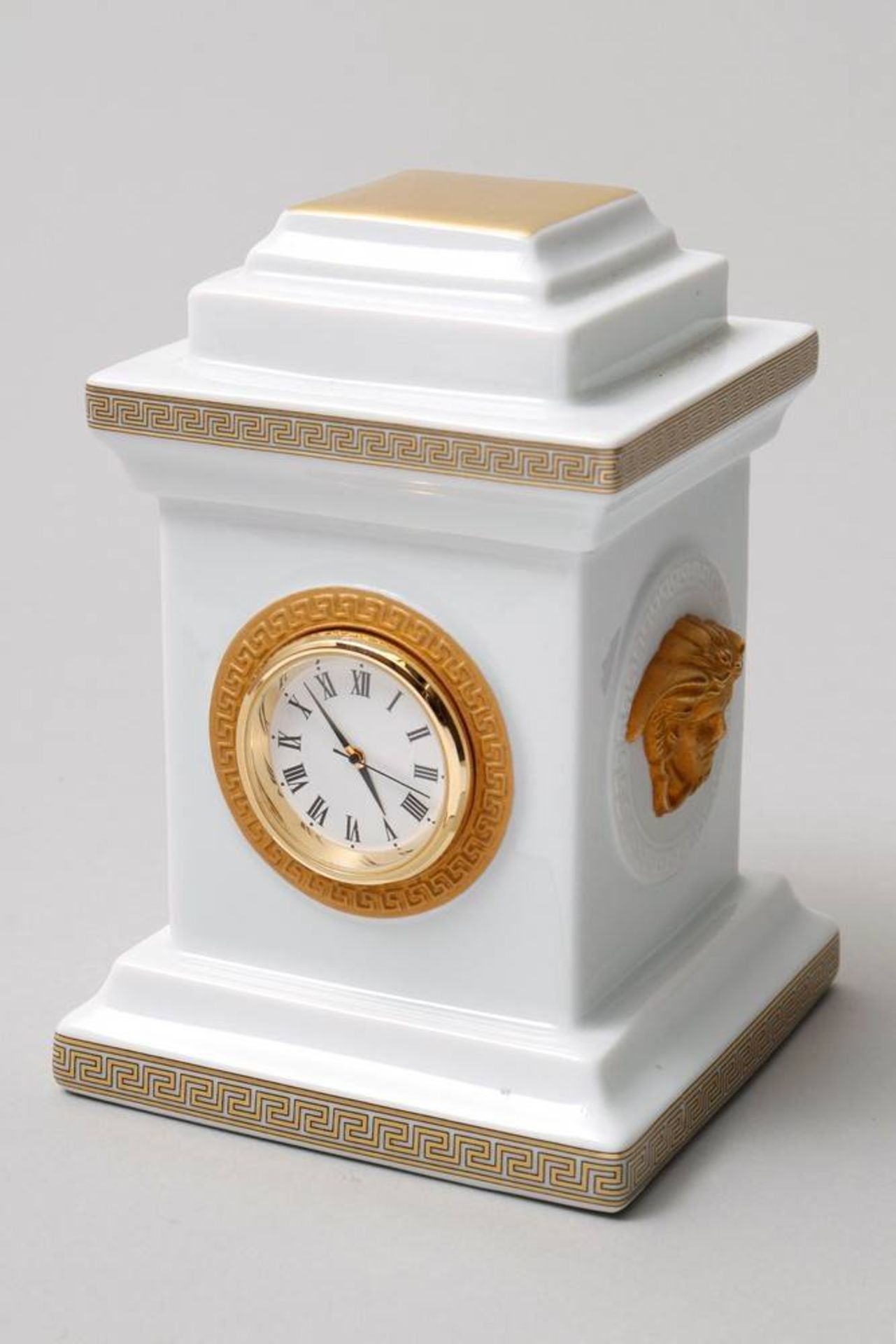 Small Table Clock Rosenthal, 20th C., design Gianni Versace, decor "Gorgona", plinth shaped,