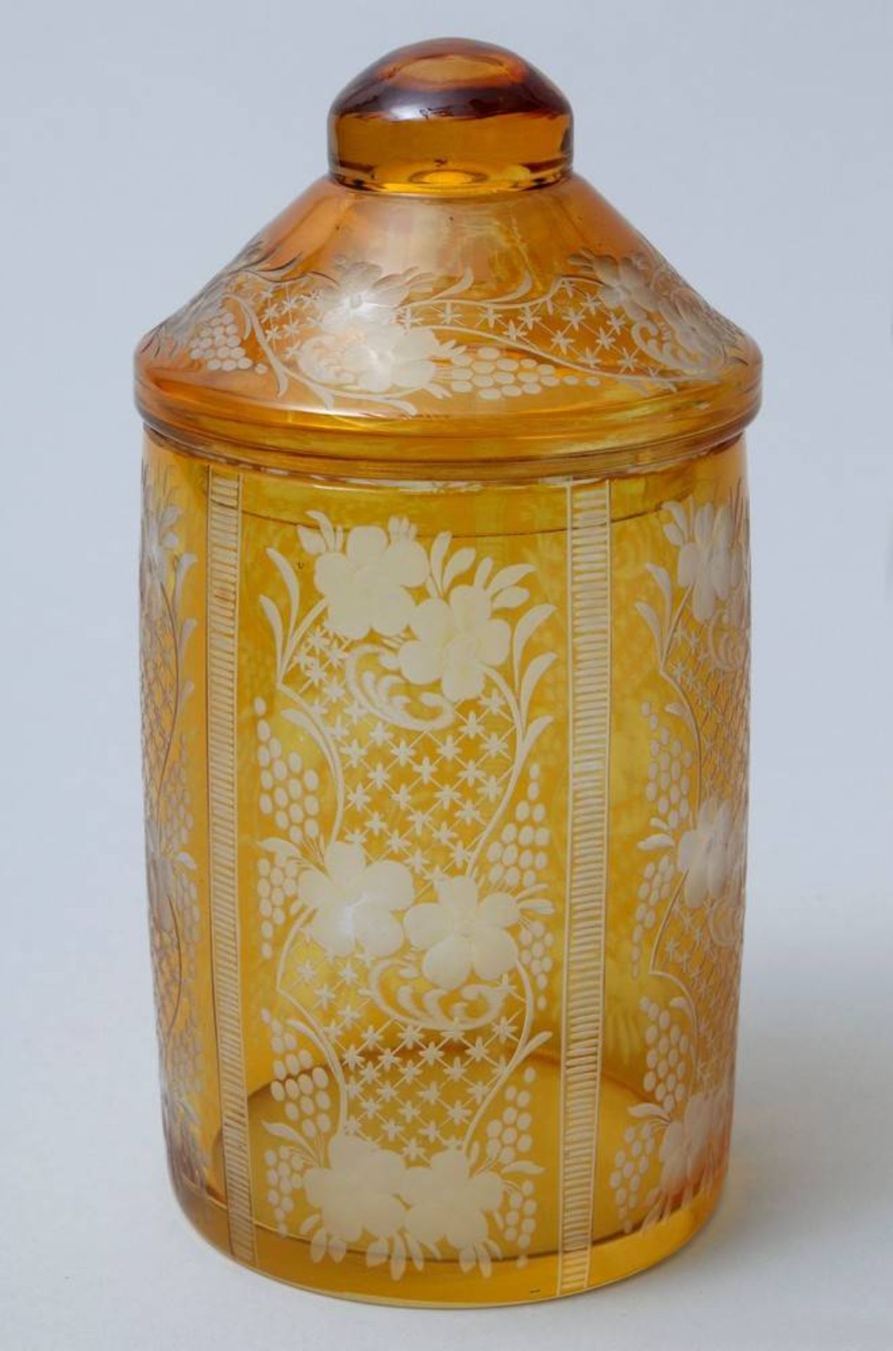 Lidded jar poss. Bohemia, ca. 1900/20, floral decoration, amber coloured glass, H:17,5cm, signs of