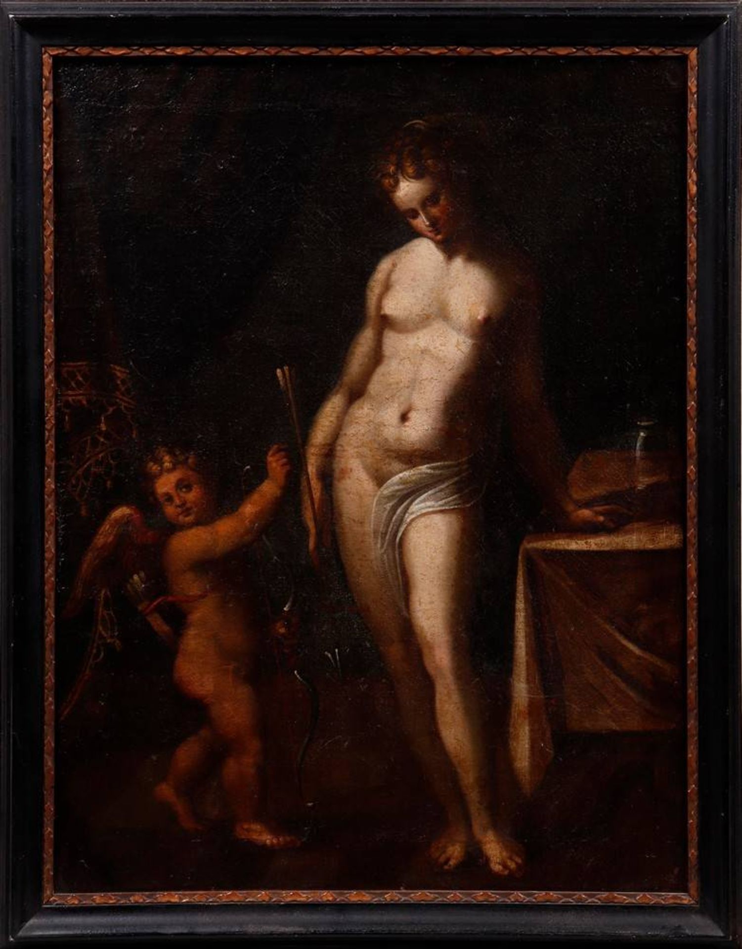 Venus und Amor Venus, sich auf einem Tisch aufstützend, nach unten blickend und einen Pfeil