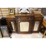 An early 20th century mahogany sideboard, rectangular platform top with two either side, above three