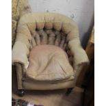 A Victorian mahogany upholstered armchair buttoned back armchair on brass castors