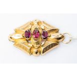 A Victorian 9ct gold and tourmaline pendant, set with three faceted  oval tourmalines, faceted and