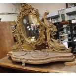 A late Victorian oak carved dressing mirror. Condition: Has a piece missing at the top and a foot