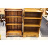 A 20th Century oak bookcase, three tier shelves above a single drawer; another similar (2)