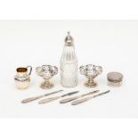A pair of pierced edge bon bon dishes, pepperette with silver cap, dressing table pot and cover