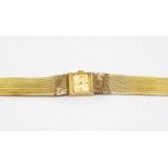 A 9ct gold Accurist ladies wrist watch, square dial with baton markers, approx. 14mm diameter, on an