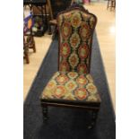 A Victorian mahogany tapestry nursing chair