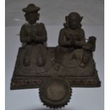 A Malaysian bronze prayer group figure of a family together offering thank you