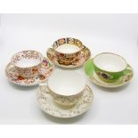 Early to mid 19th Century Derby tea cups and saucer sets, including chocolate cups, in golds,