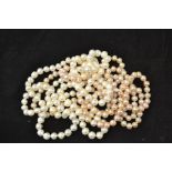 Two fresh water cultured pearl necklaces, one with a pink overtone the other white, lengths