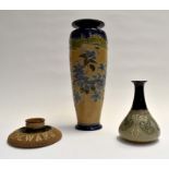 A Royal Doulton Dewars match holder; a large Doulton vase number 6764 and a Lovatts bottle vase A/