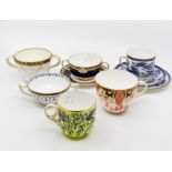 A collection of late 19th and early 20th Century Royal Crown Derby chocolate cups and tea cups