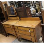 A 20th Century oak Chest of Drawers; a similar mirror back dressing table. (2)