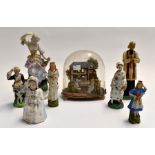 A late 19th Century domed diorama along with late 19th / early 20th Century figures