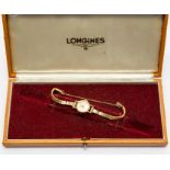 Longines- A 9ct gold Longines ladies watch, round champagne dial, diameter approx. 17mm, gold tone