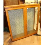 A 20th Century oak glazed cabinet