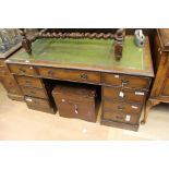 An early 20th century mahogany twin pedestal desk, leather writing surface.