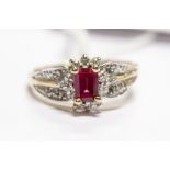 A ruby and diamond set dress ring, comprising a rectangular cut ruby, claw set with a brilliant