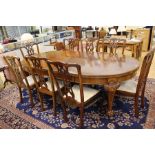 A 19th Century style extending dining table with six matching dining chairs and two similar, all