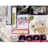 A collection of costume jewellery including necklaces, bracelets and rings