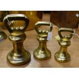 Three brass 'bank weights' £50, £20 and 7lb (3)