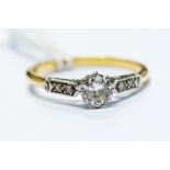 A diamond solitaire ring, 18ct gold, diamonds to each shoulder, approx 0.40ct, size P, total gross