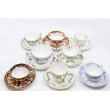 A collection of 13 Royal Crown Derby late 19th Century and early 20th Century tea cups and