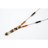 Scottish Interest - An agate necklace, with eight faceted cylindrical links, suspending thee