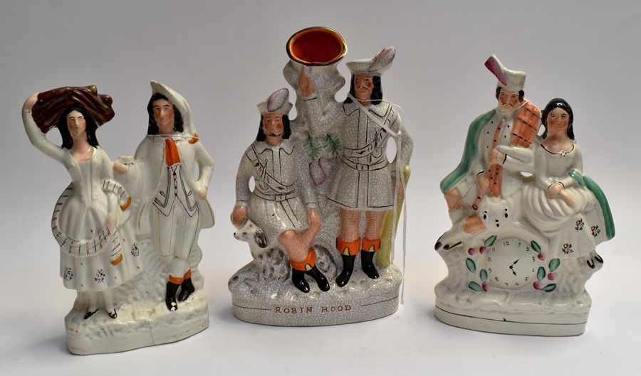 A collection of three Staffordshire flatbacks, all figural, in groups of two. (3)