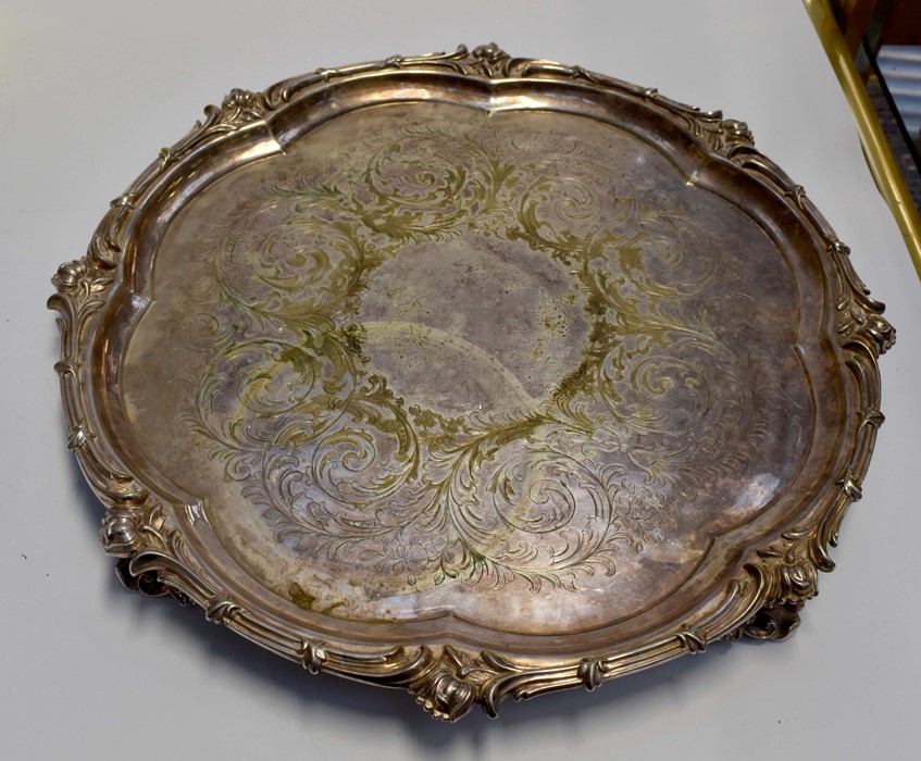An Elkington & Co silver plated circular tray with raised leafage border and four pierced scroll - Image 2 of 2