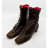 A pair of Queen Victoria's brown kid leather boots, the monograms inside are in red silk leather,
