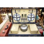 Two vintage cased picnic sets, one in navy leatherette case and retailed by Bentalls, the other in